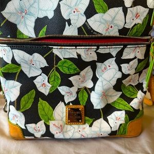 Dooney and Burke flowered satchel. Large outside pocket.